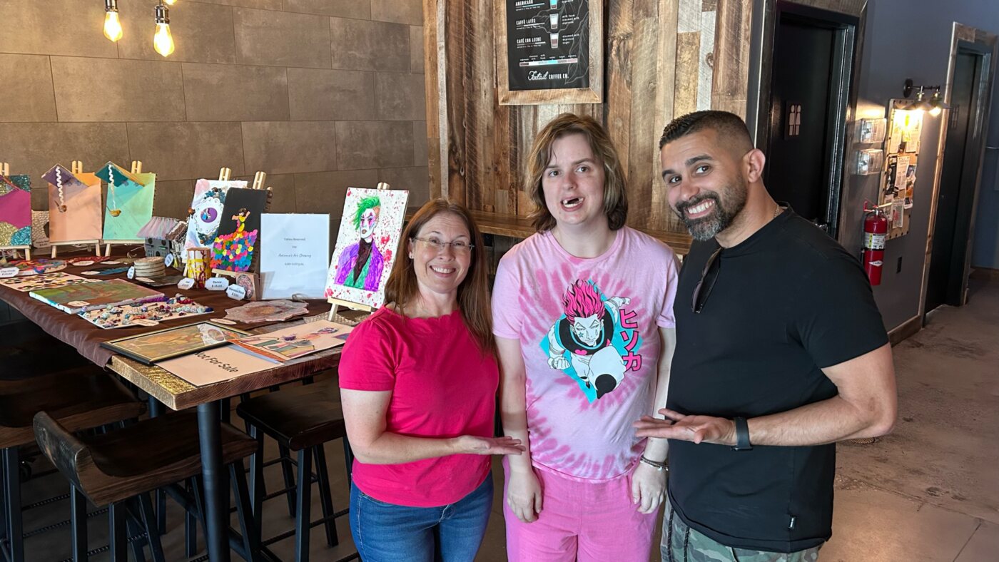 Friends celebrating at a community art event