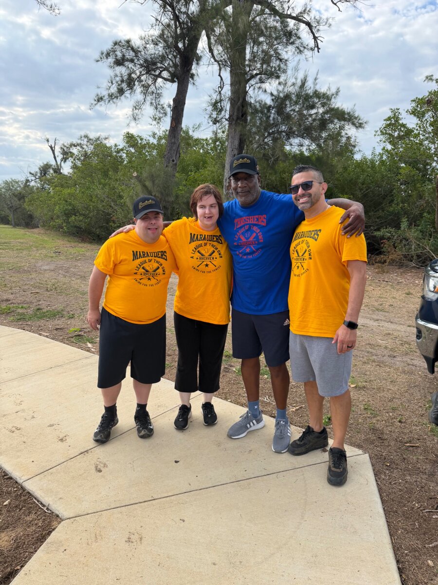 Friends together at a community baseball event