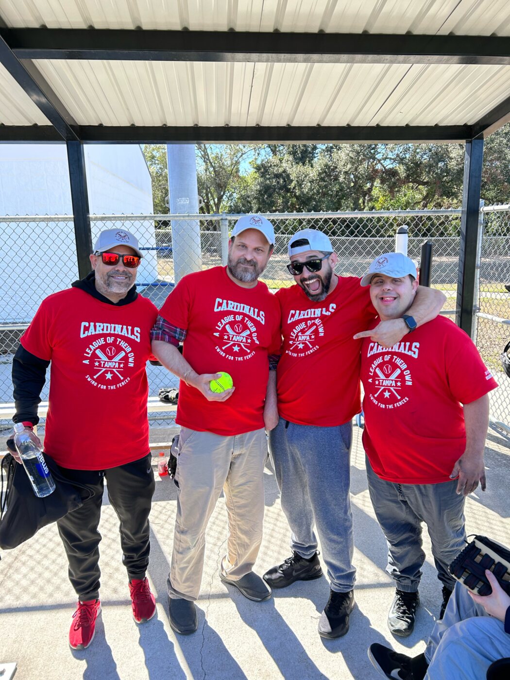 Friends together at a community softball event